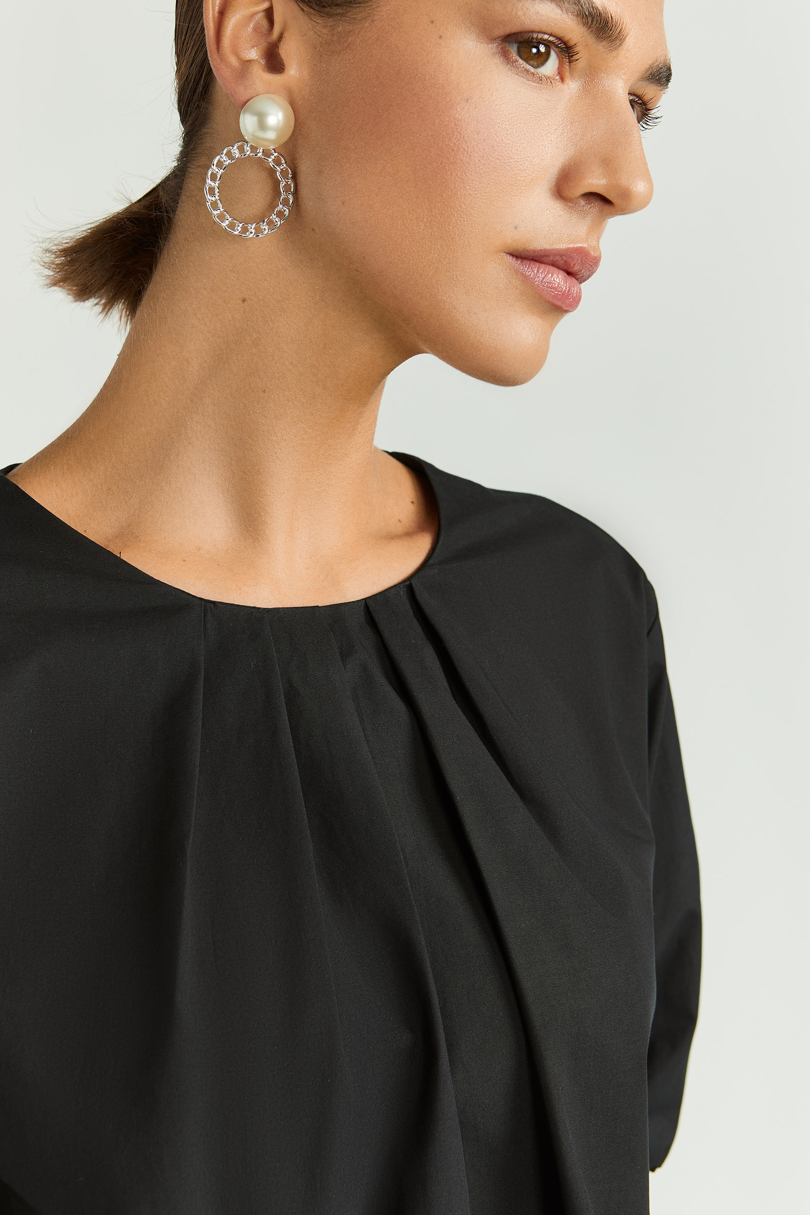 Blouse met asymetrische plooien