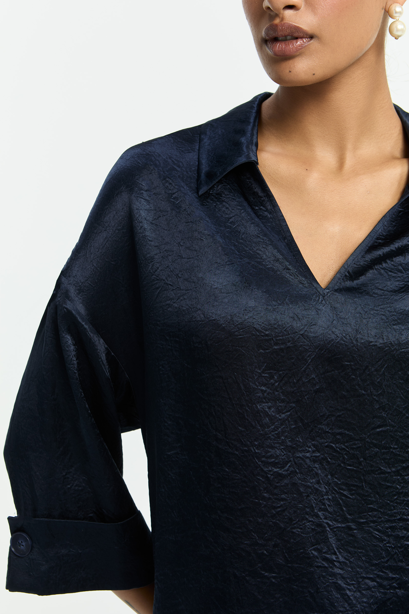 Blouse with sophisticated pleats