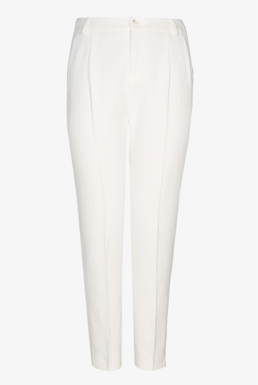 White trousers with a pressed leg crease