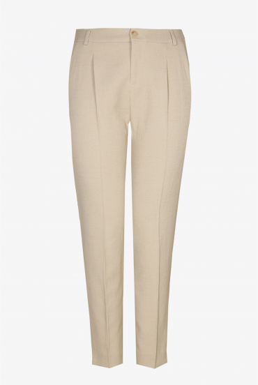 Beige trousers with a pressed leg crease