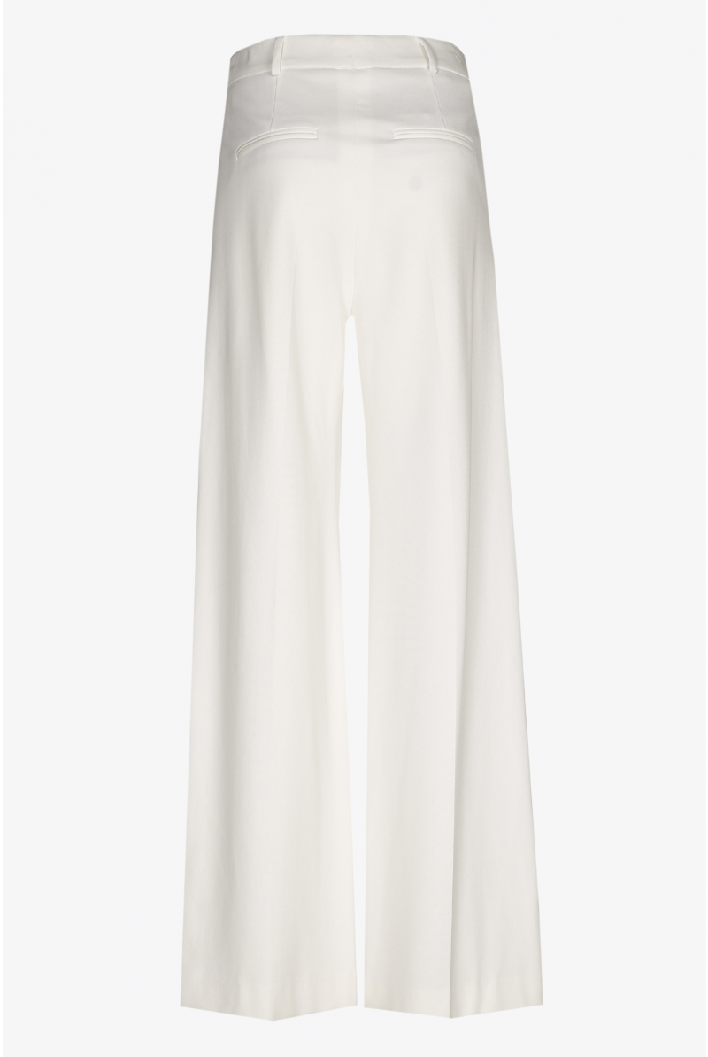 White summer trousers with wide legs and a pressed crease