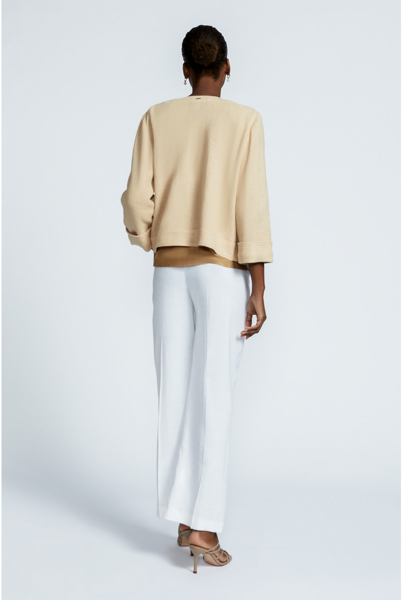 Short jacket in raffia
