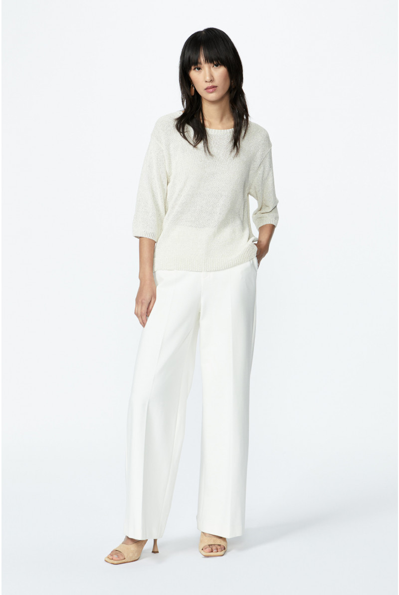 Wide trousers with a pressed crease