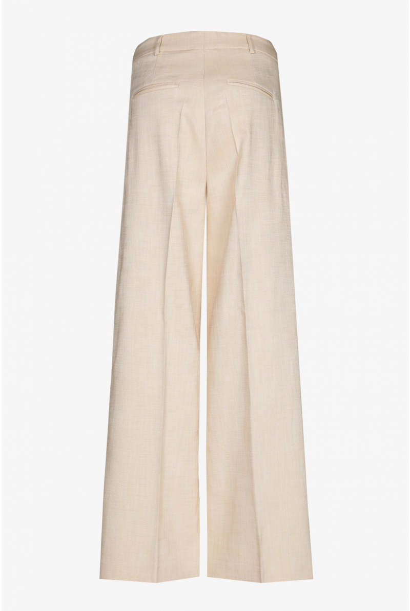 Loose trousers with a pressed crease