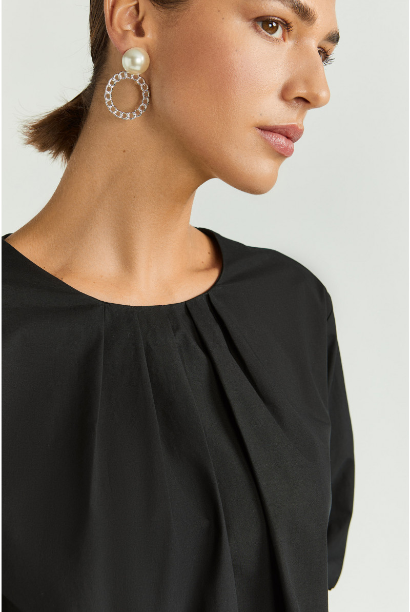 Blouse met asymetrische plooien