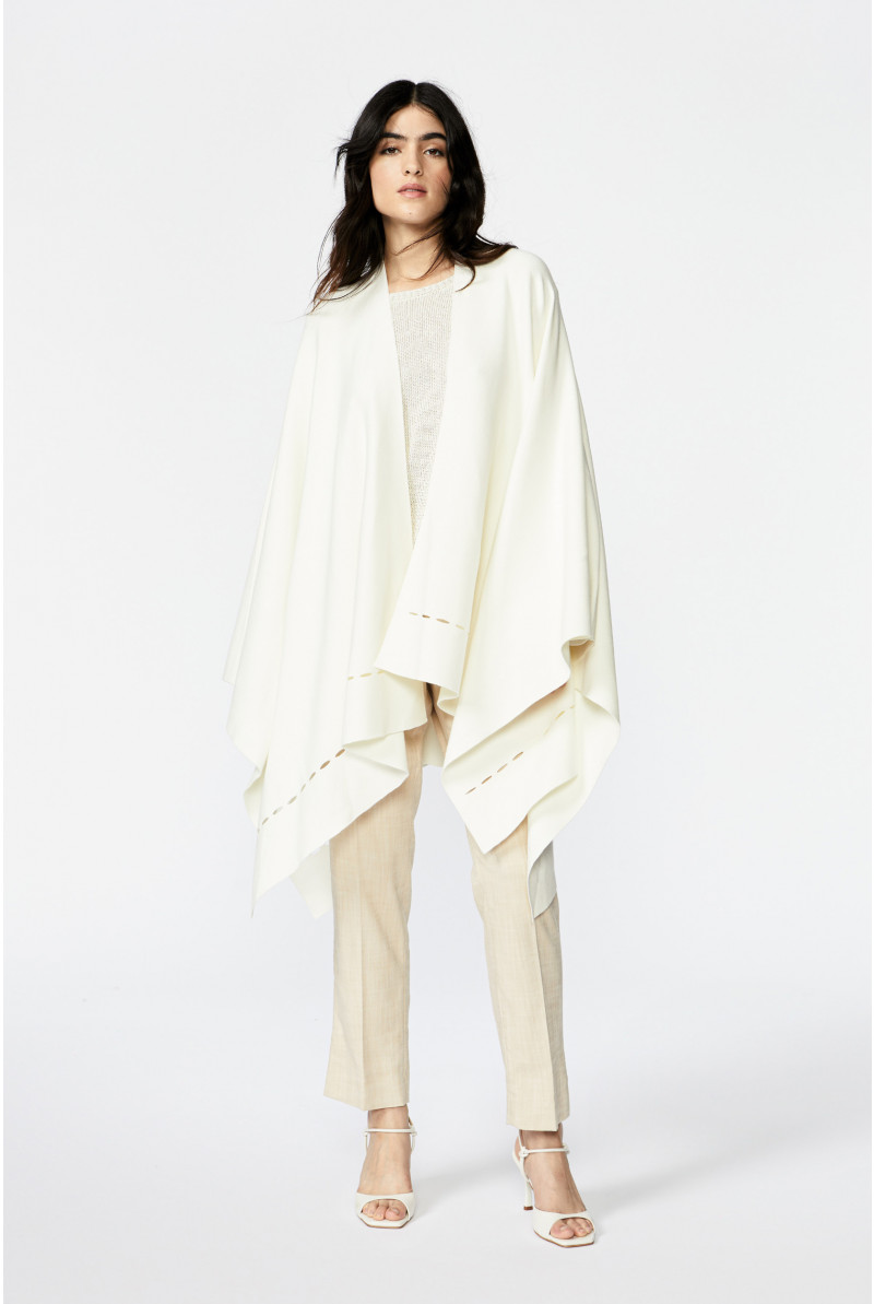 Poncho with whimsical details