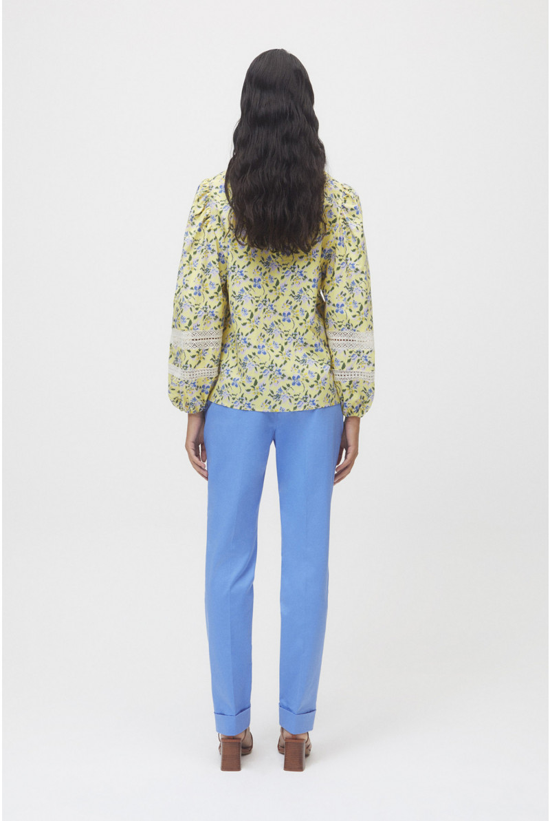 Pastel yellow blouse with blue floral print