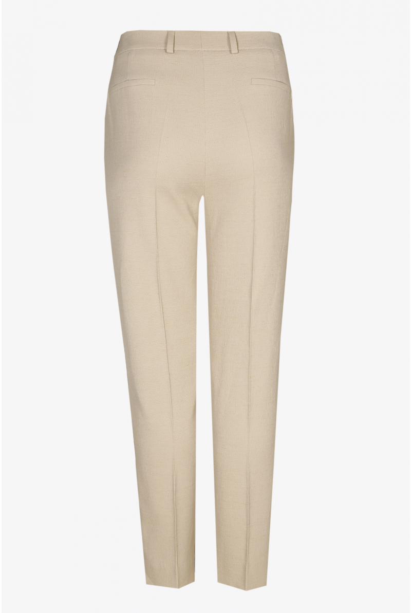 Beige trousers with a pressed leg crease