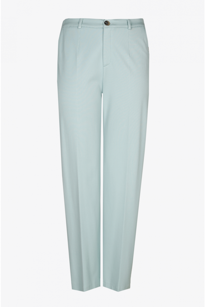 Wide light green trousers with a pressed crease and elastic in the waist