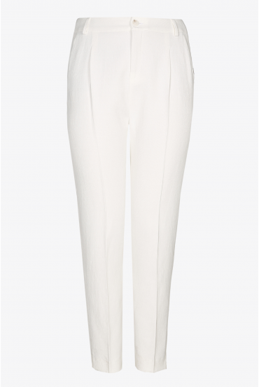 White trousers with a pressed leg crease