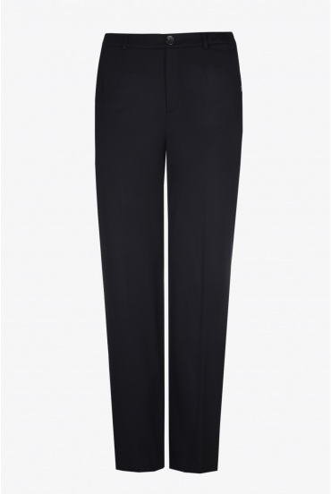 Wide dark blue trousers with a pressed crease and elastic at the waist