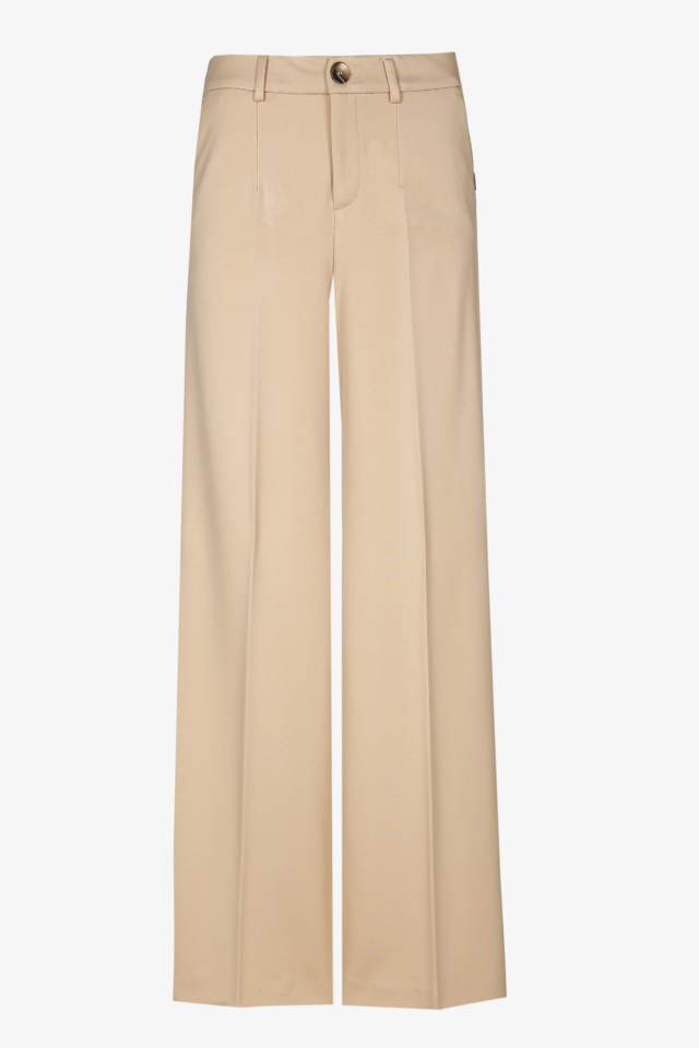 Wide beige trousers with a pressed crease