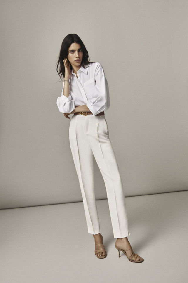 White trousers with a pressed leg crease