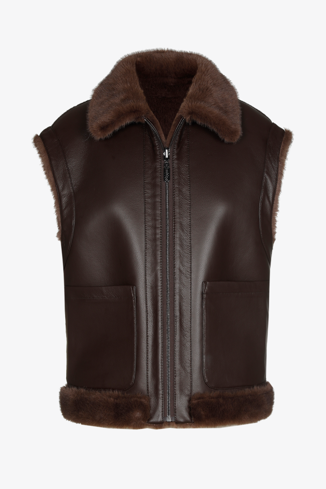 Veste réversible contenant de la fausse fourrure